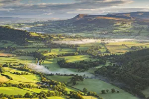 Wisps of mist float over the Usk Valley on an autumnal morning, Brecon Beacons, Powys Wisps of mist float over the Usk Valley on an autumnal morning, Brecon Beacons, Powys