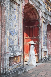 Woman wearing Ao Dai dress at Dien Tho inside Citadel, Hue, Thua Thien-Hue, Vietnam (MR) Woman wearing Ao Dai dress at Dien Tho inside Citadel, Hue, Thua Thien-Hue, Vietnam (MR)
