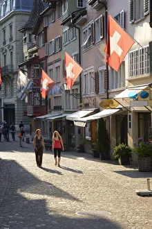 Two women walking in Augustinergasse, Zurich, Switzerland, Europe Two women walking in Augustinergasse, Zurich, Switzerland, Europe