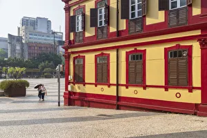 Central Library Gallery: Women walking past Central Library on Tap Seac Square Macau, China