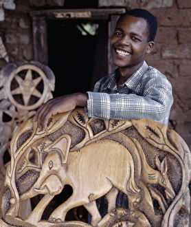 A wood carver puts the finishing touches to a Chiefs chair A wood carver puts the finishing touches to a Chiefs chair
