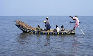 A wooden fishing boat with fish traps in the bow leaves Rwenshama A wooden fishing boat with fish traps in the bow leaves Rwenshama