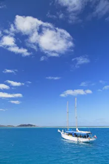 Yacht in lagoon with Malolo Island, Mamanuca Islands, Fiji Yacht in lagoon with Malolo Island, Mamanuca Islands, Fiji