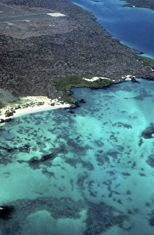 Aerial view of SW corner of Baltra with shallows and end of old WWII runway. Baltra, Galapagos Islands Aerial view of SW corner of Baltra with shallows and end of old WWII runway. Baltra, Galapagos Islands