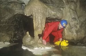 Difficult Gallery: A caver in Kingsdale master cave, Yorkshire Dales, UK
