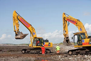 Global Warming Gallery: Construction workers working on the foreshore of the Solway Firth near Workington
