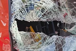A crashed car with a smashed windscreen