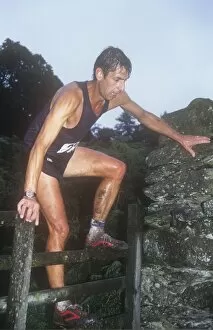 Down Hill Gallery: A fell runner competing in a fell race in the Lake District, UK