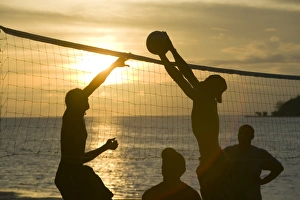 Fijian men playing beach volleyball at sunset at the Walu Beach Resort on Malolo Island Fijian men playing beach volleyball at sunset at the Walu Beach Resort on Malolo Island