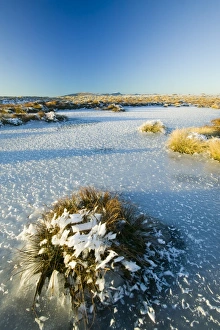A frozen tarn on Red Screes in the Lake District UK A frozen tarn on Red Screes in the Lake District UK
