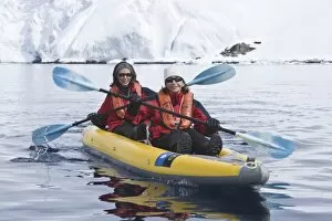 Life Jackets Gallery: Lindblad Expeditions guests kayaking among the ice in Antarctica as part of expedition travel