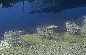 Supermarket trolleys thrown into Whitehaven harbour by vandals, Cumbria, UK