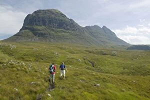 Assynt Gallery: Walkers approaching Suilven mountain in Sutherland Scotland UK