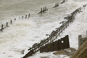 Waves crashing against the sea defences at Happisburgh on the Norfolk Coast Waves crashing against the sea defences at Happisburgh on the Norfolk Coast