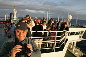 Whale-watchers on the top deck of 30, 000 ton ferry, off the coast of France Whale-watchers on the top deck of 30, 000 ton ferry, off the coast of France