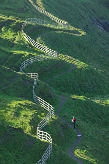A winding fence and the South West Coast Path near Port Isaac in Cornwall UK