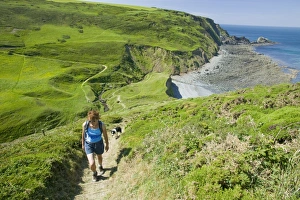 A women on the South West Coast Path near Hartland Point Devon UK A women on the South West Coast Path near Hartland Point Devon UK
