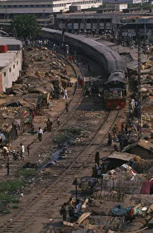 BANGLADESH, Dhaka Train travelling through Tejgoan slum with ramshackle dwellings BANGLADESH, Dhaka Train travelling through Tejgoan slum with ramshackle dwellings
