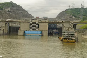 China, Hubei, Sandouping Sand barge approaching the westbound 5 step locks at the China, Hubei, Sandouping Sand barge approaching the westbound 5 step locks at the