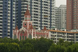 China, Hubei, Wuhan The Catholic Cathedral among modern apartment blocks China, Hubei, Wuhan The Catholic Cathedral among modern apartment blocks