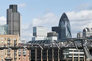 The City of London financial centre and the Millenium bridge, London, England The City of London financial centre and the Millenium bridge, London, England