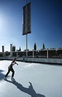 England, London, Boy on an Ice skating rink under a sign for th Saatchi Gallery on the England, London, Boy on an Ice skating rink under a sign for th Saatchi Gallery on the