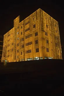 Bangladesh, Dhaka, Gulshan, Apartment block at night lit up for a wedding with strings of fairy lights cascading over the side EyeUbiquitous_20108328