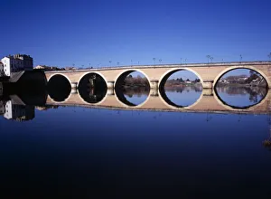 FRANCE, Dordogne, Perigeux Bergerac. Old bridge over River Dordogne with its FRANCE, Dordogne, Perigeux Bergerac. Old bridge over River Dordogne with its