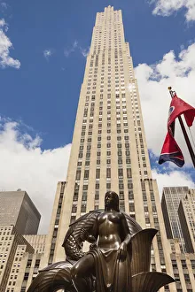 GE Building and The Maiden, one of the Mankind Figures, Rockefeller Center, Manhattan GE Building and The Maiden, one of the Mankind Figures, Rockefeller Center, Manhattan