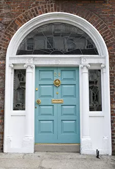 Georgian doorway near Merrion Square with light blue door and arched white surround