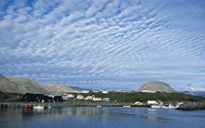 Iceland, Skagafjorour, Hofsos Island, Seaside village with boats on water and houses built along shoreline Iceland, Skagafjorour, Hofsos Island, Seaside village with boats on water and houses built along shoreline