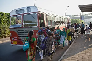 India, Mumbai, Passengers board a bus outside Chhatrapati Shivaji International Airport India, Mumbai, Passengers board a bus outside Chhatrapati Shivaji International Airport