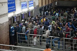 India, New Delhi, Passengers queue at the ticket office in Delhi Junction Railway Station