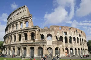 Italy, Lazio, Rome, Colosseum, classic view of the Colosseum with blue sky & light cloud