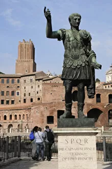 Italy, Lazio, Rome, Froi Imperiali, statue of Trajan with Trajans market behind