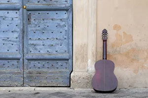 Italy, Lazio, Rome, Piazza de Santa Maria de Trastevere, guitar & wall Italy, Lazio, Rome, Piazza de Santa Maria de Trastevere, guitar & wall
