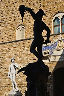 Italy, Tuscany, Florence, Piazza della Signoria, Replica of the famous David statue by Michelangelo with silhouette of Italy, Tuscany, Florence, Piazza della Signoria, Replica of the famous David statue by Michelangelo with silhouette of