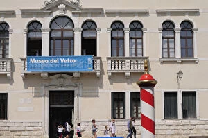 Italy, Veneto, Venice, Murano, family passing Glass Museum