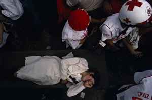 MEXICO, Mexico City Woman being carried through crowd on stretcher by emergency MEXICO, Mexico City Woman being carried through crowd on stretcher by emergency