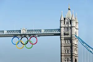 The Olympic rings suspended from the gantry of London's Tower Bridge celebrate the London The Olympic rings suspended from the gantry of London's Tower Bridge celebrate the London