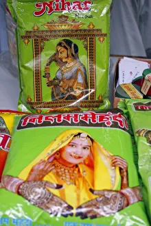 Plastic packets of henna for sale illustrated with pictures of attractive women with henna patterns on hands and wrists Plastic packets of henna for sale illustrated with pictures of attractive women with henna patterns on hands and wrists