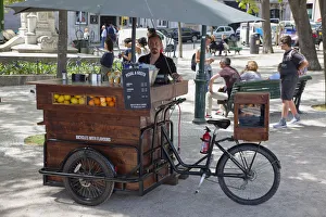 Portugal, Estremadura, Lisbon, Bairro Alto, Fruit juice vendor in Sao Pedro de Alcantara gardens Portugal, Estremadura, Lisbon, Bairro Alto, Fruit juice vendor in Sao Pedro de Alcantara gardens