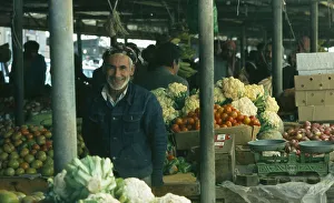 Qatar, Doha, The Souk or market with man selling vegetables at his stall Qatar, Doha, The Souk or market with man selling vegetables at his stall
