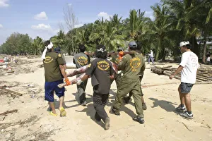 Rescue workers collect Bodies that were out at sea and now litter the coastline Rescue workers collect Bodies that were out at sea and now litter the coastline