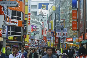 Shibuya Center Gai main shopping area Sunday crowds and multitude of shop signs Shibuya Center Gai main shopping area Sunday crowds and multitude of shop signs
