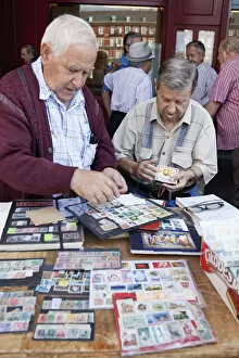 Images Dated 18th August 2014: Spain, Madrid, Stamp collectors in the Plaza Mayor