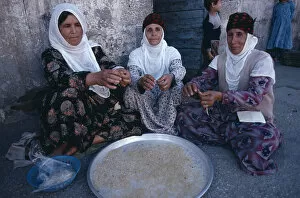 TURKEY, Diyarbakir Kurdish women handmaking noodles