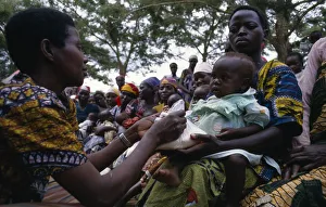 UGANDA Health worker giving nutritional advice to mothers with vulnerable babies UGANDA Health worker giving nutritional advice to mothers with vulnerable babies