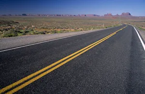 USA, Arizona, Monument Valley View from US Highway 163 across empty stretch of road USA, Arizona, Monument Valley View from US Highway 163 across empty stretch of road
