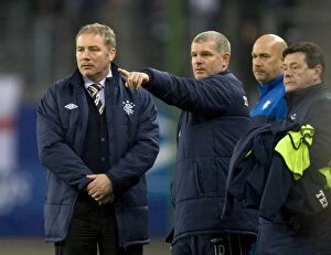 Football Action Friendly Collection: Ally McCoist and Rangers Coaching Team Face Off Against Hamburg in Intense Friendly Clash